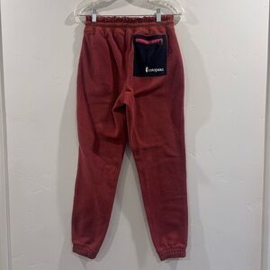 Cotopaxi Fleece Sweatpants in Rust with Blue Pocket